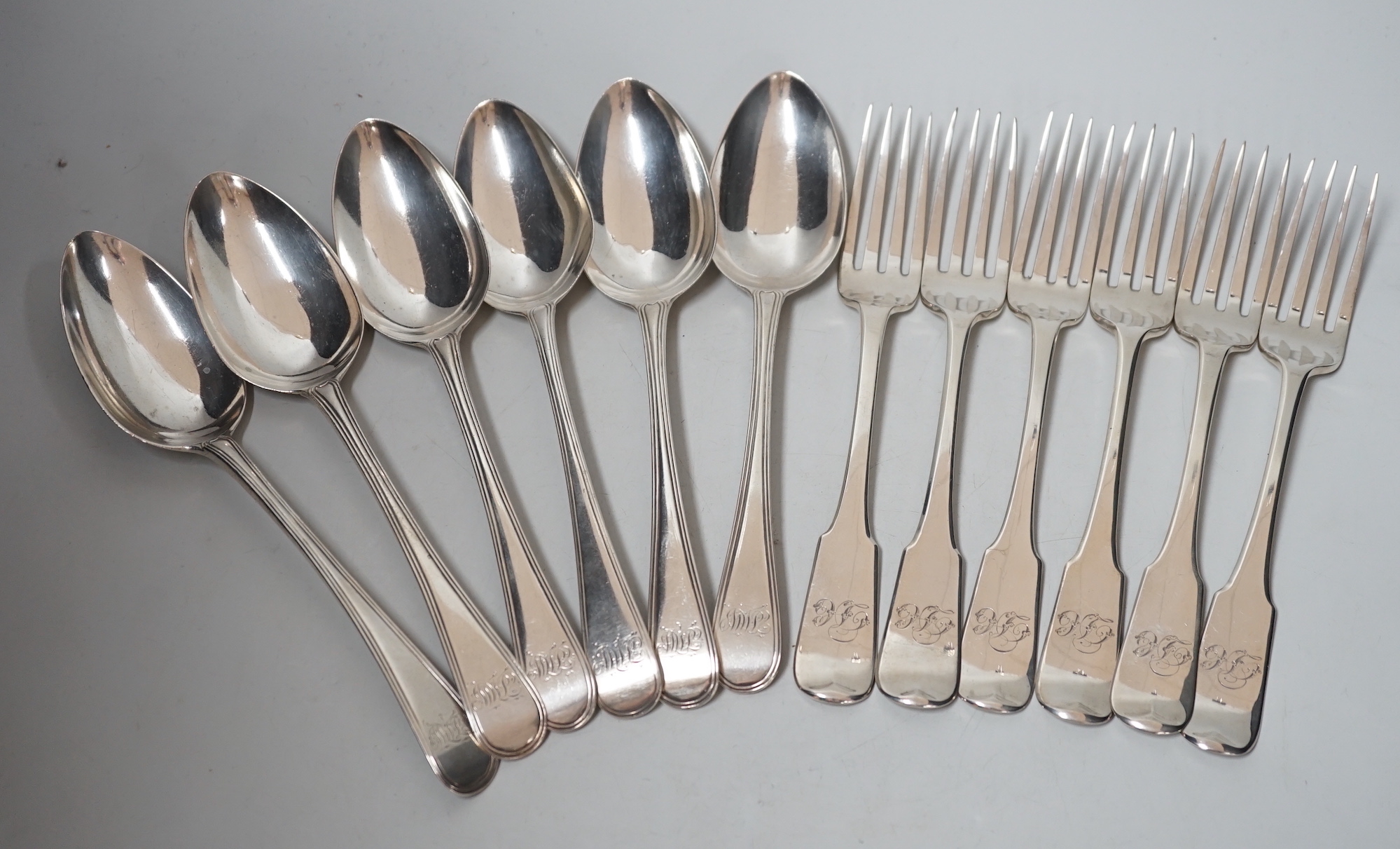 A harlequin set of six Georgian Scottish silver fiddle pattern table forks and a similar harlequin set of six Old English fiddle pattern table spoons, 24.1oz.